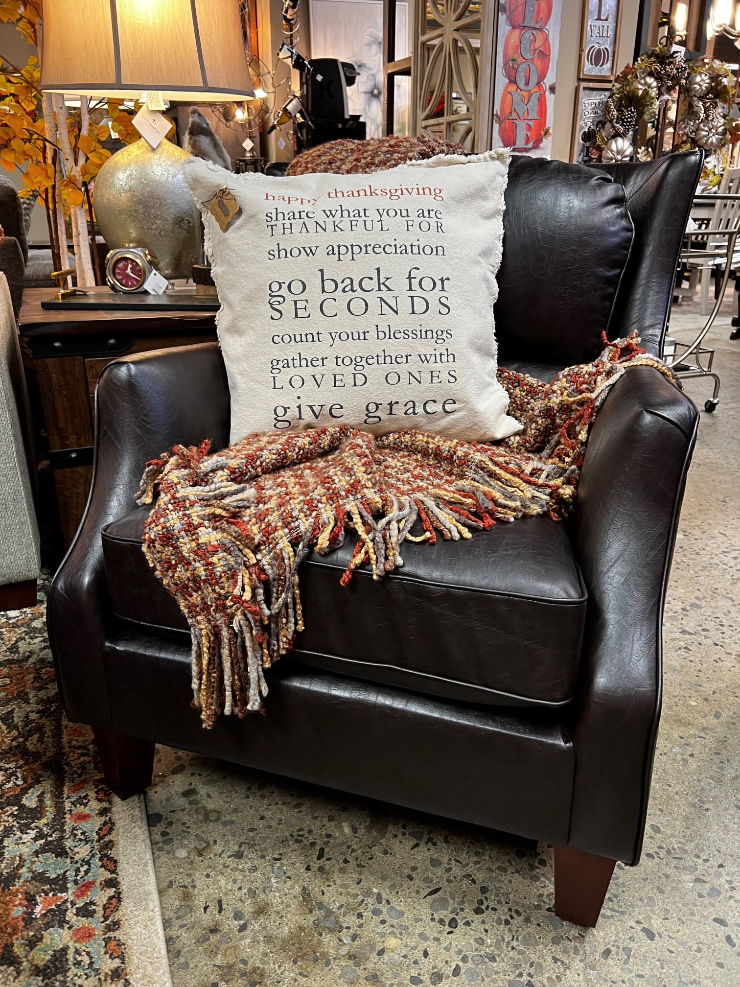 leather chair with throw blanket and pillow